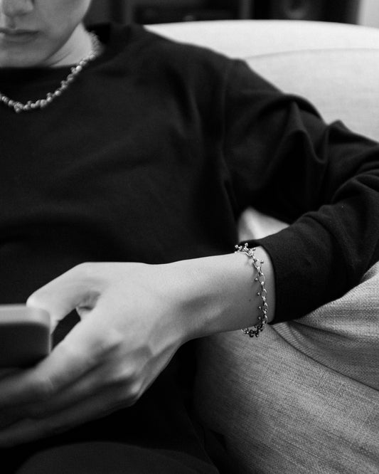 Wrist shot of POEMIC Apéritif Bracelet. Maximum durability stainless steel for 24/7 waterproof wear.