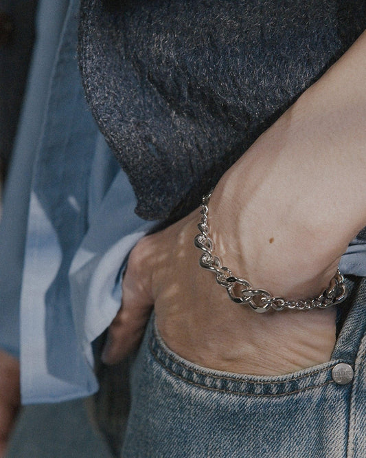 POEMIC Tonal Bracelet styled on model wrist. Adjustable 6"-8" fit for effortless elegance styling.