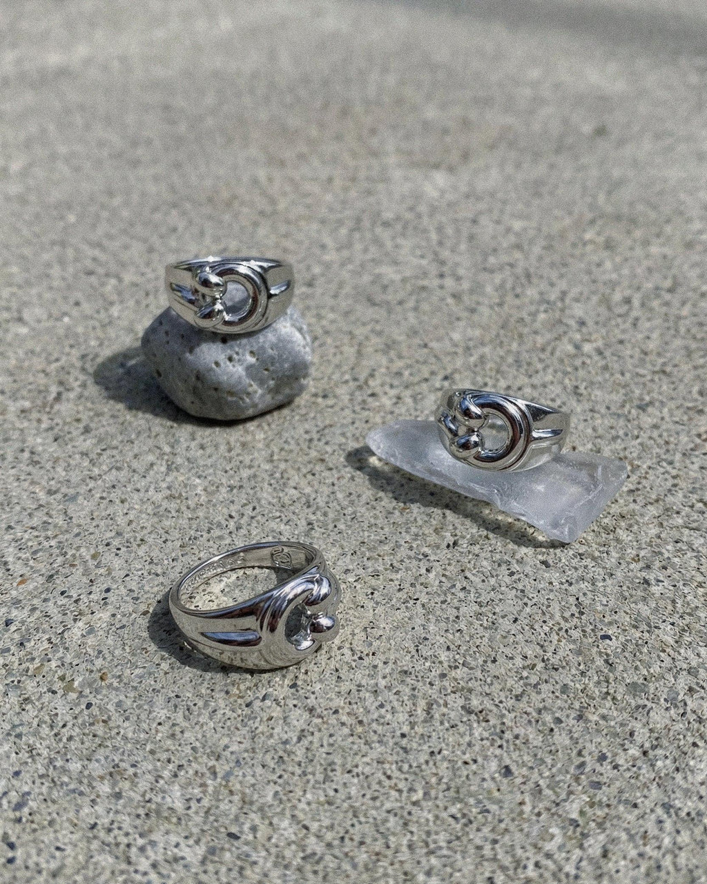 POEMIC Lucid Ring concrete background. Waterproof, sweat-proof everyday essential.