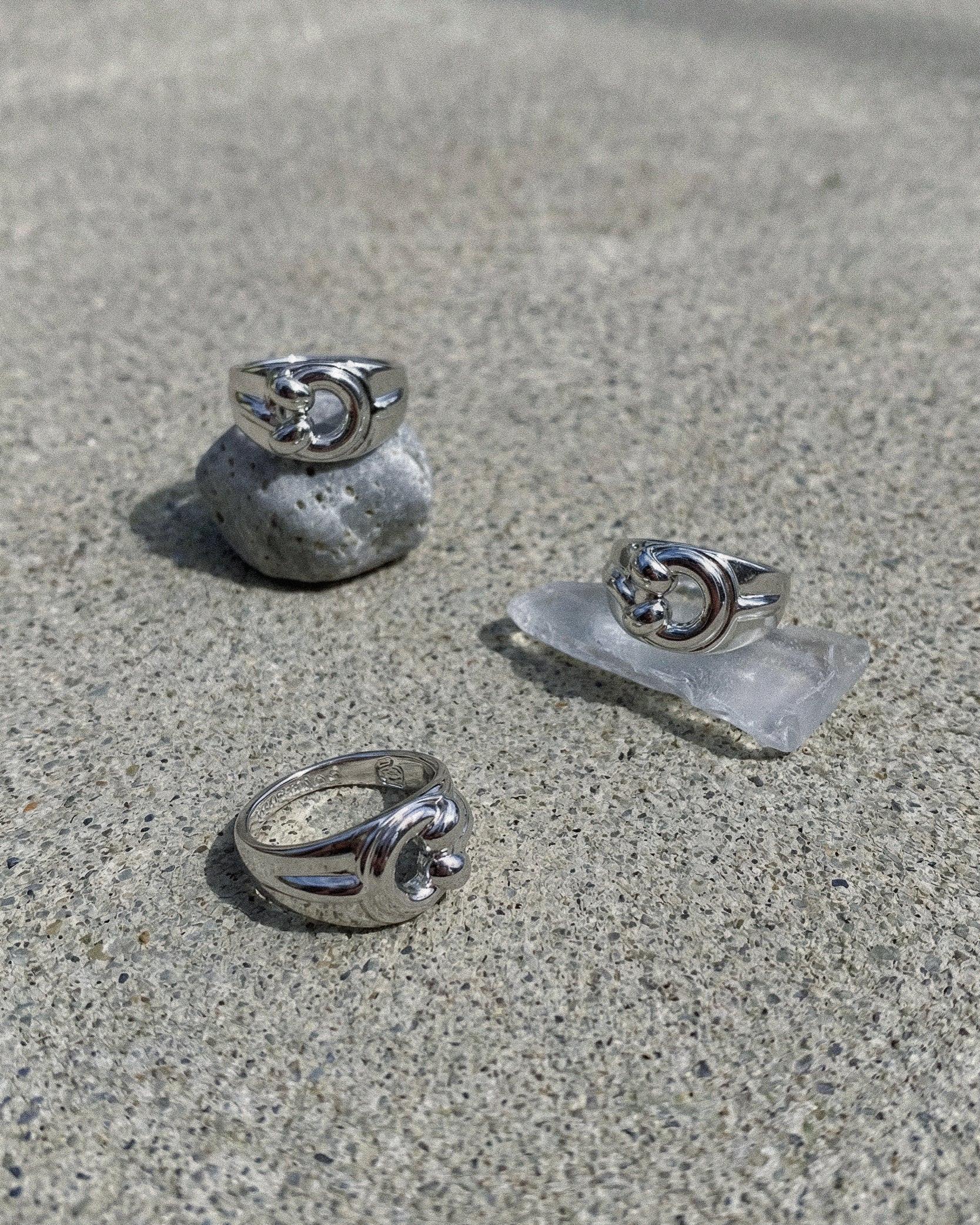 POEMIC Lucid Ring concrete background. Waterproof, sweat-proof everyday essential.