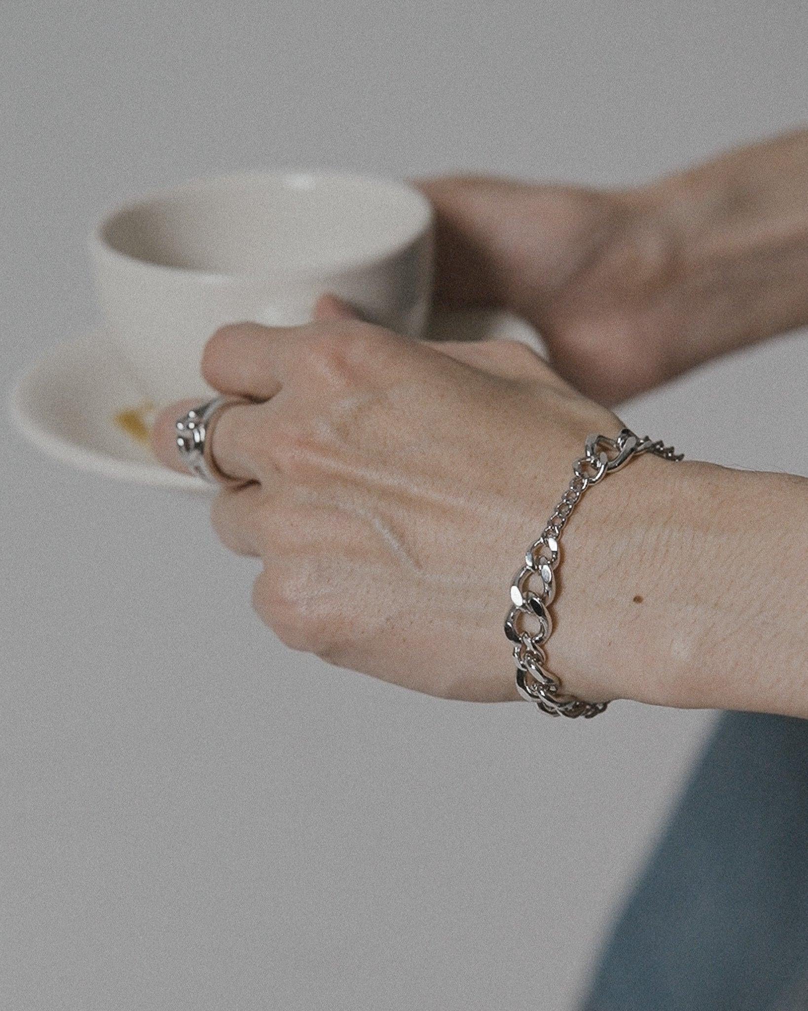 POEMIC Tonal Bracelet shown casually. Sweat-proof jewelry designed to be never taken off, active living ready.
