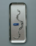 POEMIC Tonal Bracelet laid in a metal tray
